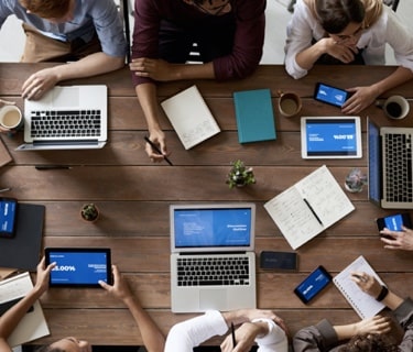 top view of 6 people sitting at table